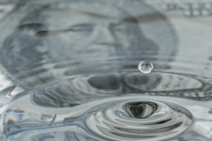 image of a water and money depicting high water bill