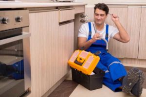 image of homeowner perforning diy plumbing repair