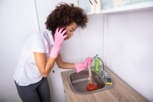 woman with a clogged sink