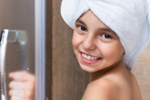 little kid enjoying hot shower