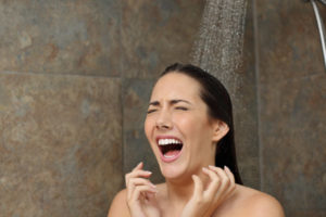 image of a woman in a cold shower