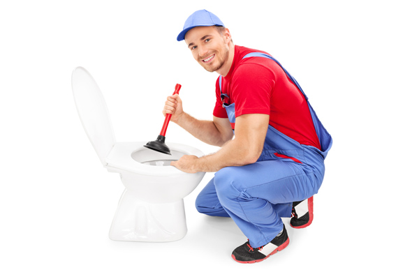 plumber removing a toilet clog