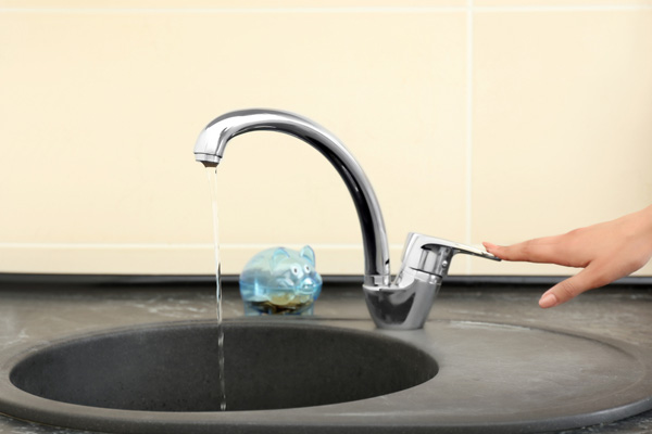 turning off faucet to conserve water at home