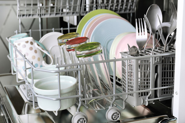image of a homeowner loading dishwasher