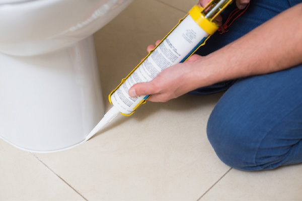 image of a toilet repair by a plumber