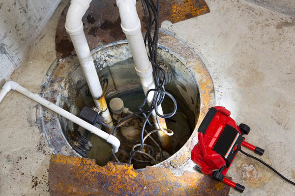 image of removing sump pump from pit