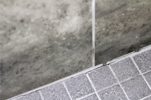 image of cracked grout in bathroom