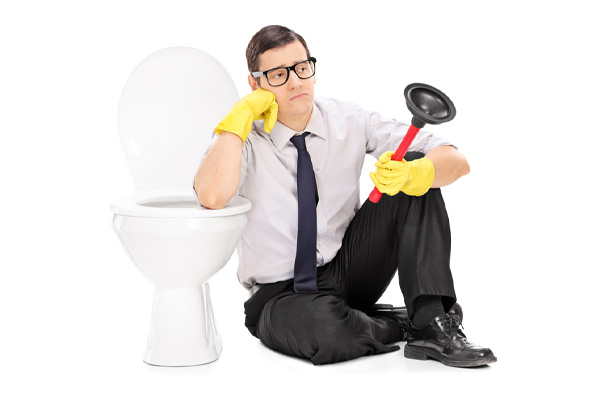 image of a homeowner who is frustrated with clogged toilet