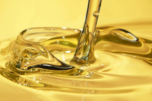 pouring gold liquid depicting disposing oil properly