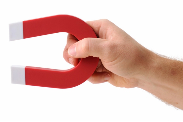 hand holding a magnet