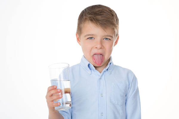 image of a child drinking water that tastes salty