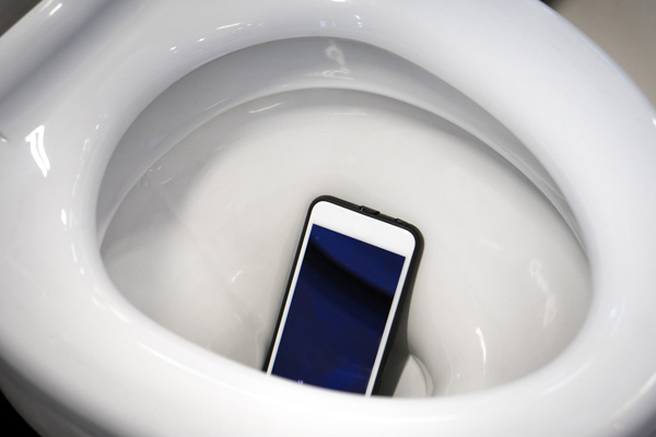 cell phone in toilet bowl