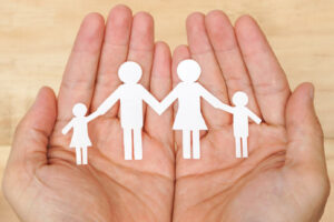 image of hands holding family depicting water heater safety