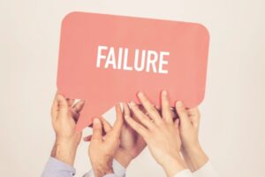 different set of hands holding speech bubble that says failure depicting sump pump