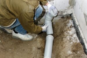 plumber doing a sewer line repair