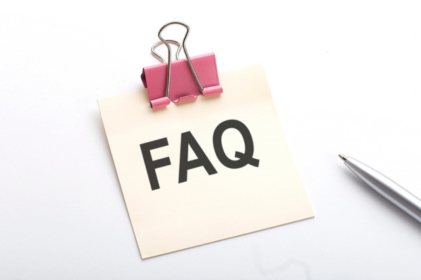 FAQ written on a paper note with a clip depicting questions about water meter reading
