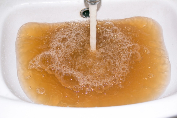 discolored water filling the sink