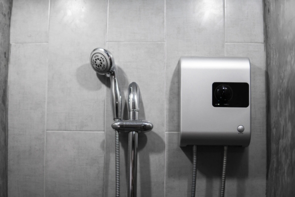 tankless water heater beside a shower